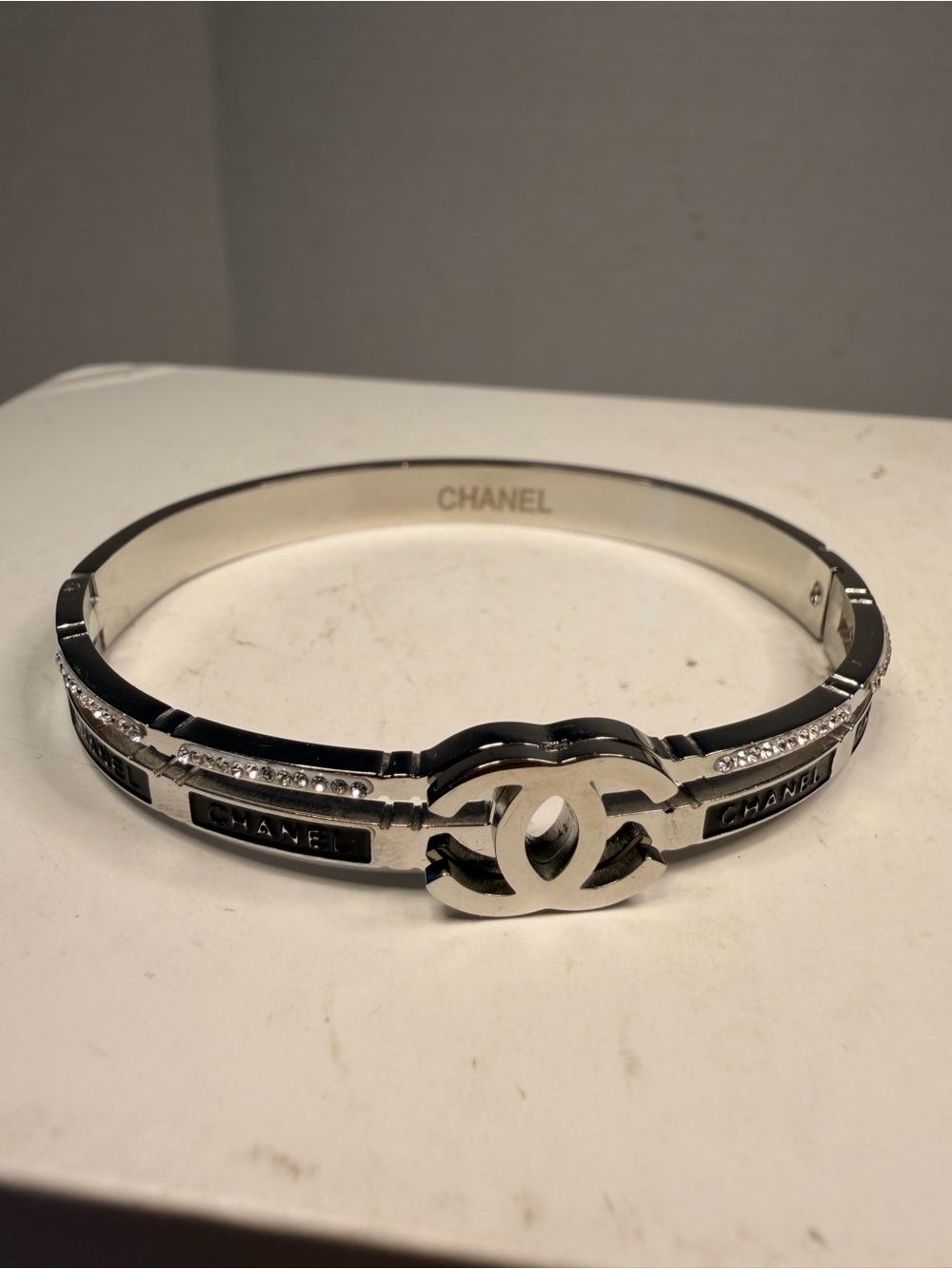 Chanel Silver-Tone CC Logo Hinged Bangle Bracelet with Crystals and Black Enamel